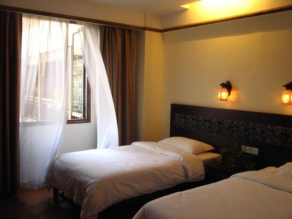 Bajie Youth Hostel Zhangjiajie Habitación foto